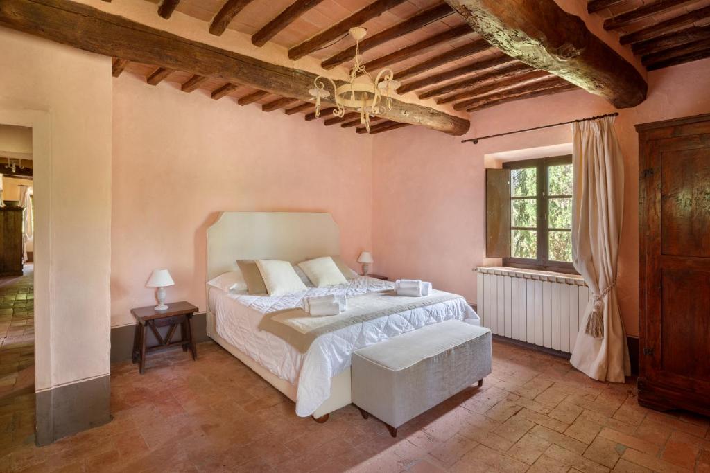 Postel nebo postele na pokoji v ubytování Castello di Bossi