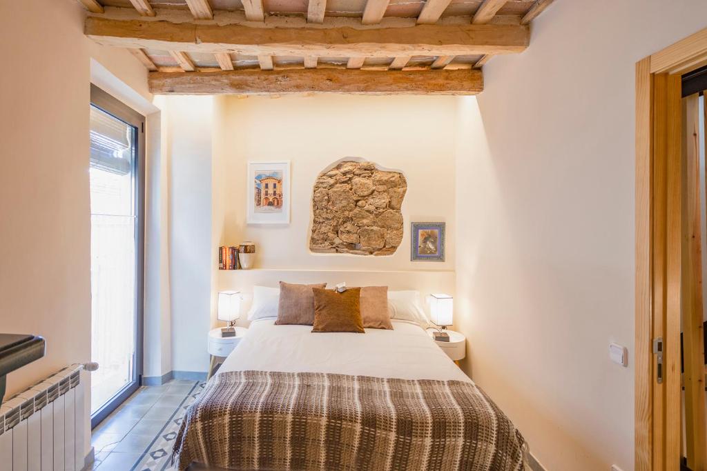 Postel nebo postele na pokoji v ubytování Cal Marti de Gironella