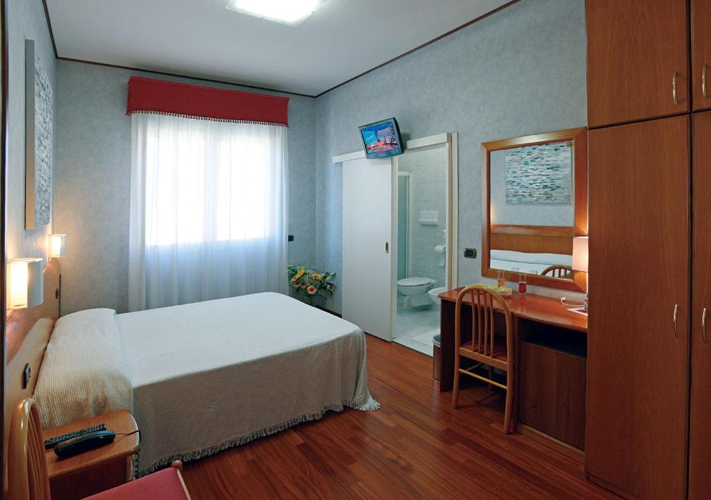 Postel nebo postele na pokoji v ubytování Hotel Autostrada