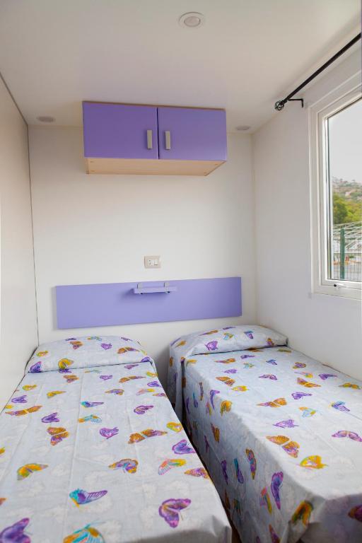 Postel nebo postele na pokoji v ubytování Camping Delfino