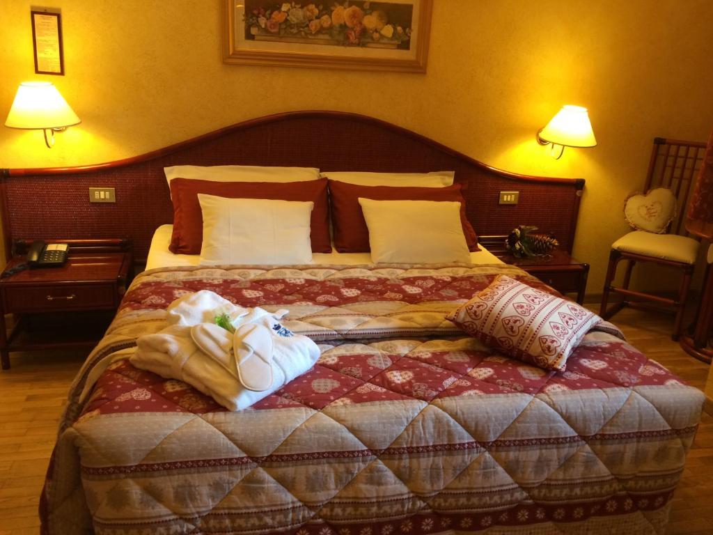 Postel nebo postele na pokoji v ubytování Grand Hotel Principe