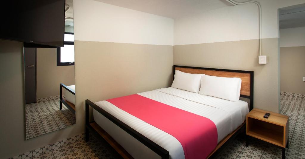 Postel nebo postele na pokoji v ubytování Hostal CASA MX centro