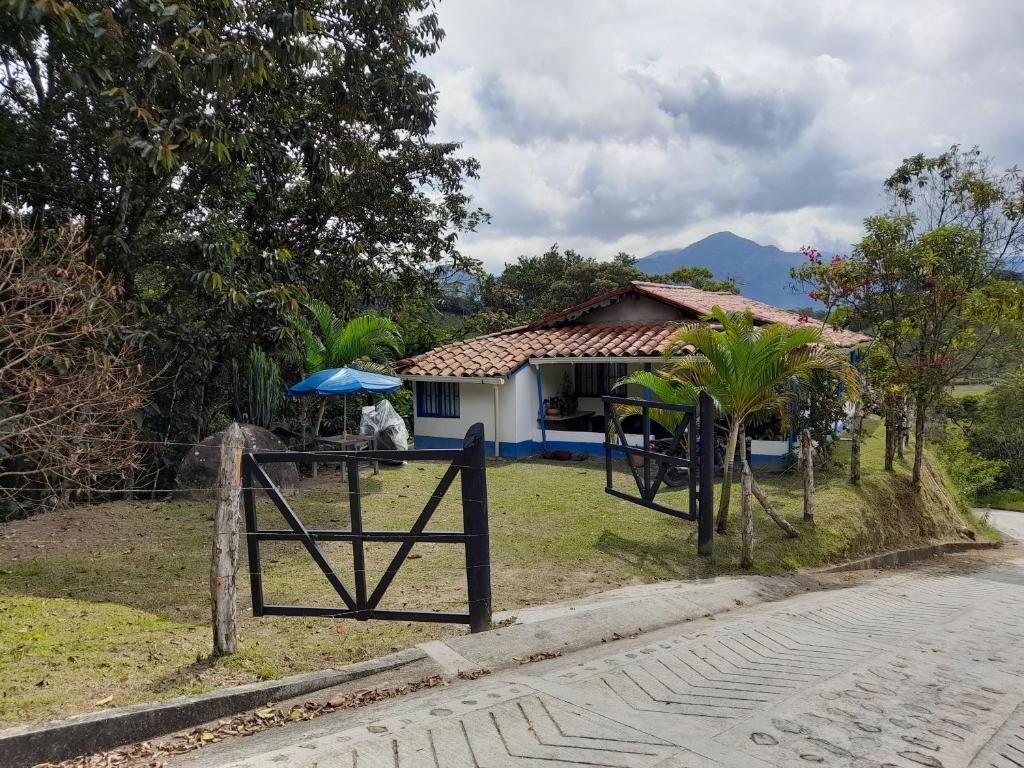 a house with a gate in front of it at Casa Horizontes in San Carlos