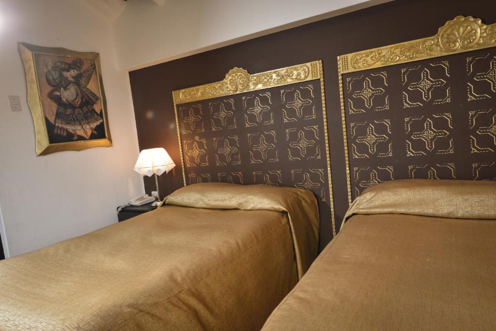 Postel nebo postele na pokoji v ubytování Tika Wasi Casa Boutique