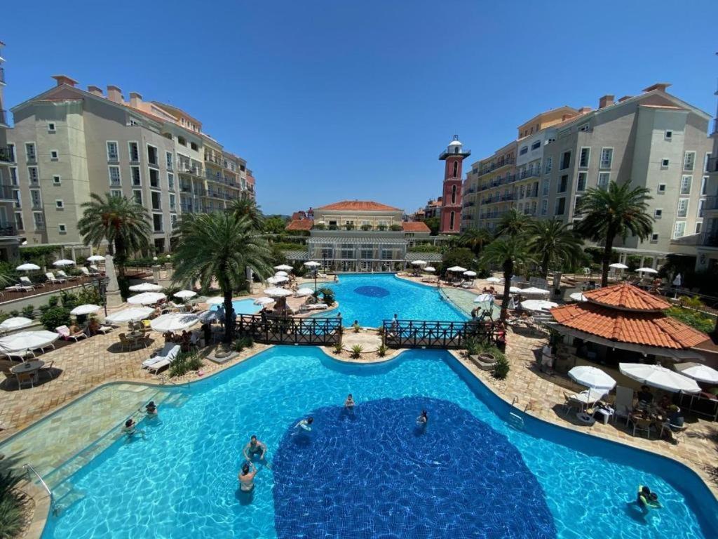 an overhead view of a large swimming pool in a resort at Studio IL Campanario Villagio Resort in Florianópolis