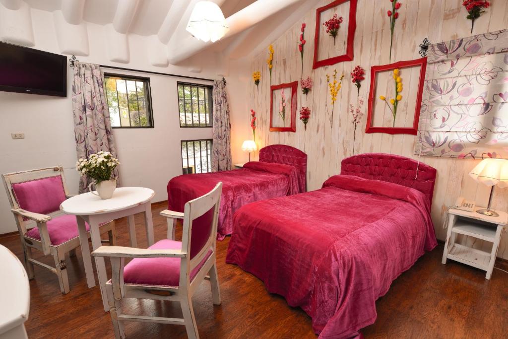 Postel nebo postele na pokoji v ubytování Tika Wasi Casa Boutique
