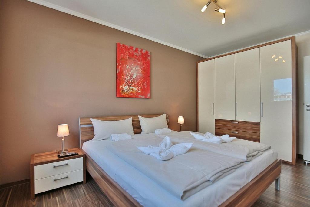 Postel nebo postele na pokoji v ubytování Residenz Herrenbruchstr Residenz Herrenbruchstraße 5 Appartement 4