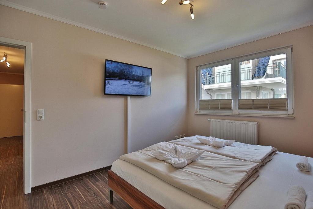 Postel nebo postele na pokoji v ubytování Residenz Herrenbruchstr Residenz Herrenbruchstraße 5 Appartement 4