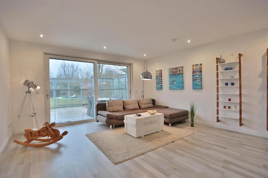 Posezení v ubytování Ferienhaus Glockenstraße Ferienwohnung Ostseehöhe Appartement 1