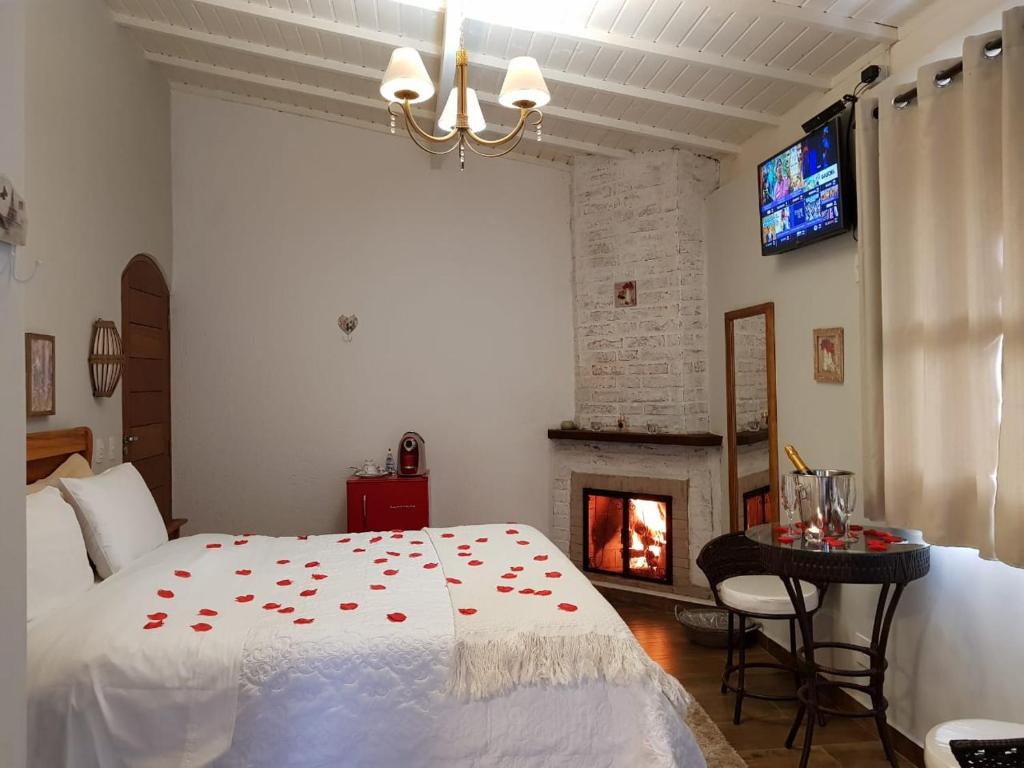 Postel nebo postele na pokoji v ubytování Pousada Villa Monte Verde