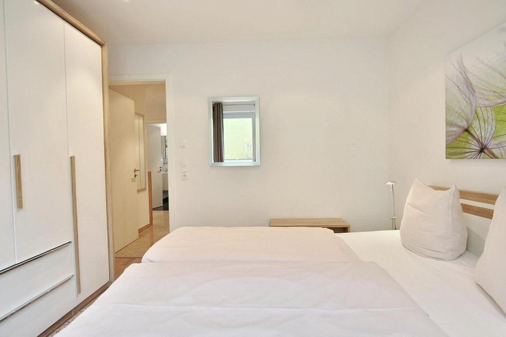 Postel nebo postele na pokoji v ubytování Parkresidenz Bergstraße 52 Parkresidenz Bergstraße 52 Appartement 2