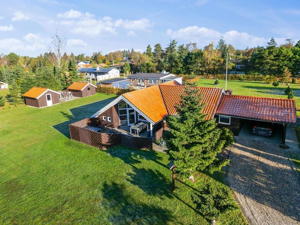 an overhead view of a house with an orange roof at Holiday home Væggerløse LXXI in Marielyst