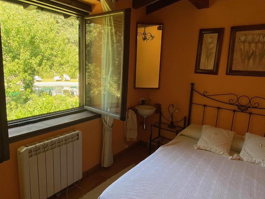 Postel nebo postele na pokoji v ubytování Jardín del Río