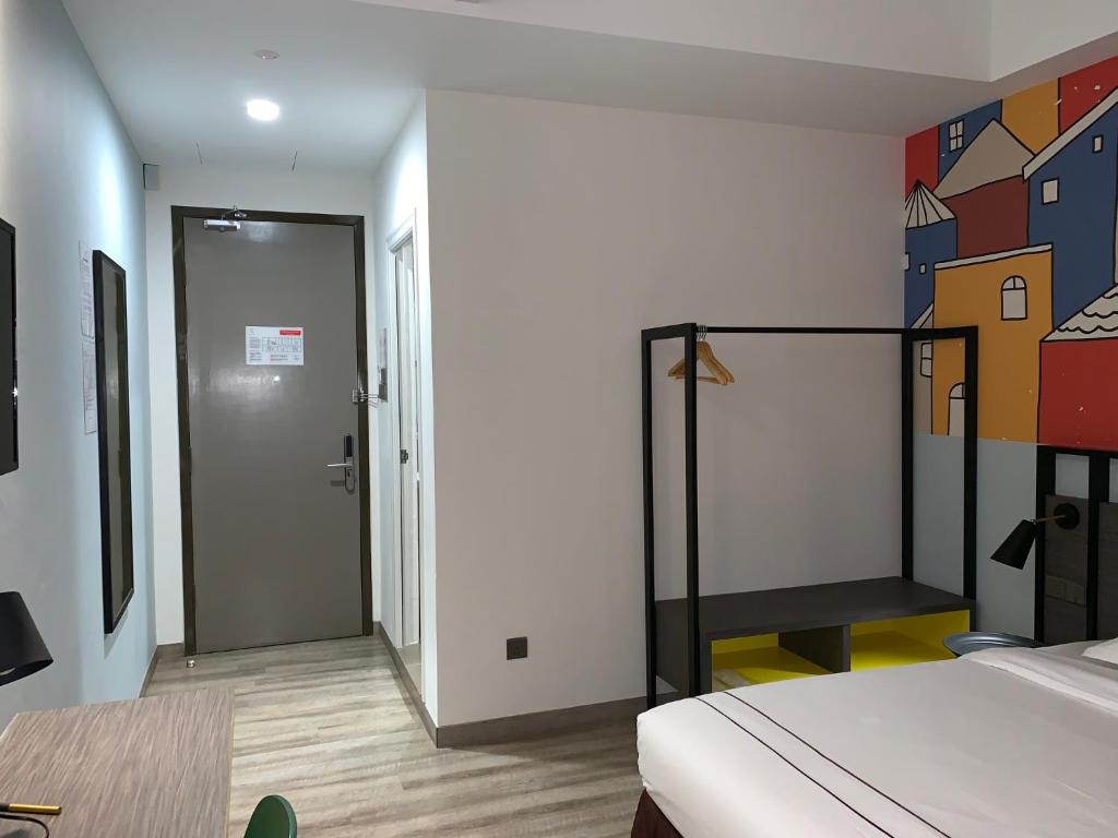 Postel nebo postele na pokoji v ubytování K Hotel
