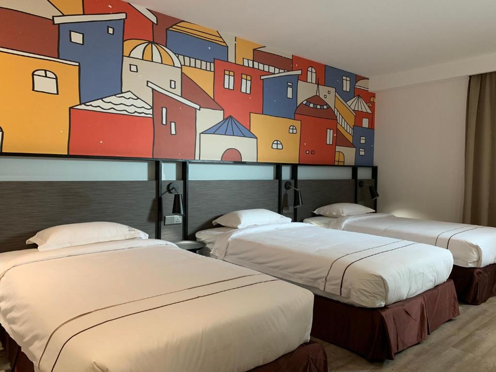 Postel nebo postele na pokoji v ubytování K Hotel