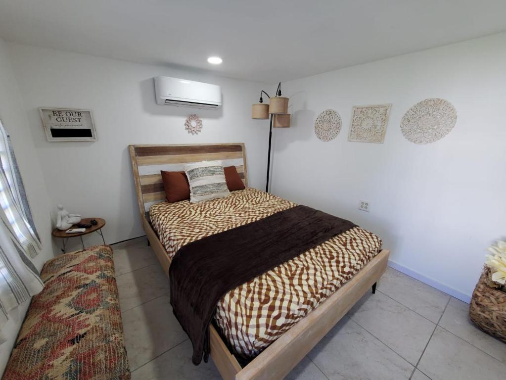 a bedroom with a bed in a room at Aguadilla Breeze apt in gated complex 8 minute walk to Crashboat beach in Aguadilla