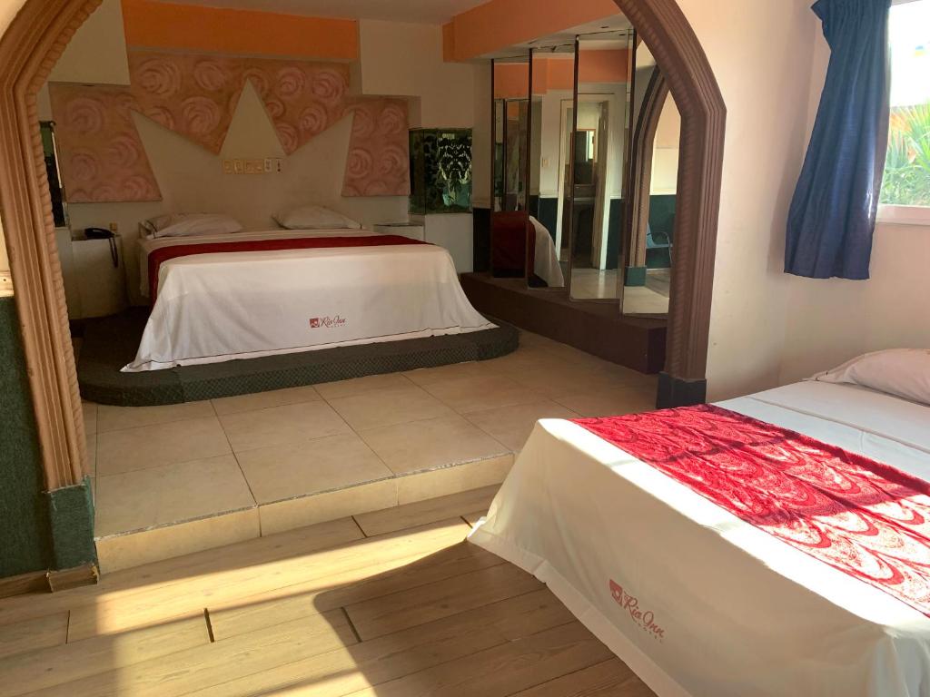 Postel nebo postele na pokoji v ubytování Hotel Rio Inn