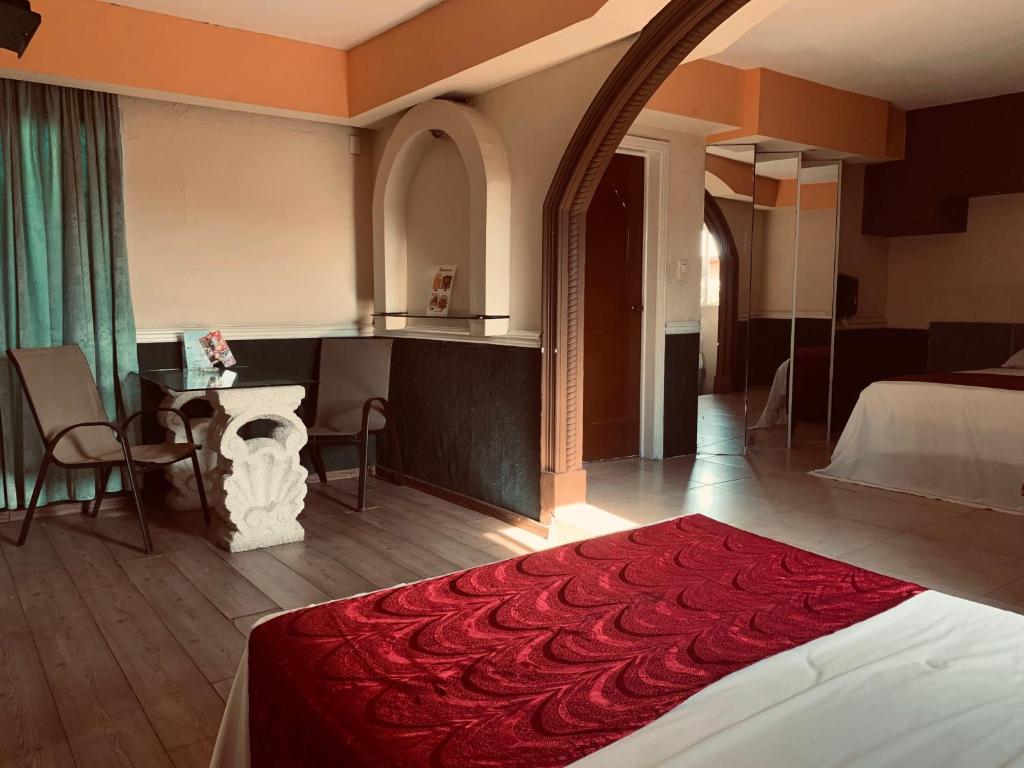 Postel nebo postele na pokoji v ubytování Hotel Rio Inn