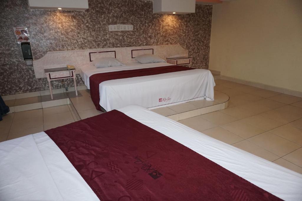 Postel nebo postele na pokoji v ubytování Hotel Rio Inn