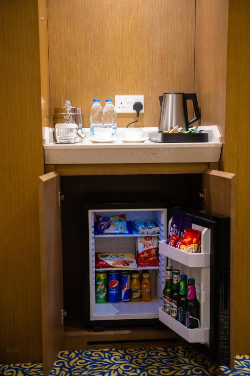Kuchyň nebo kuchyňský kout v ubytování ROZANA HOTEL