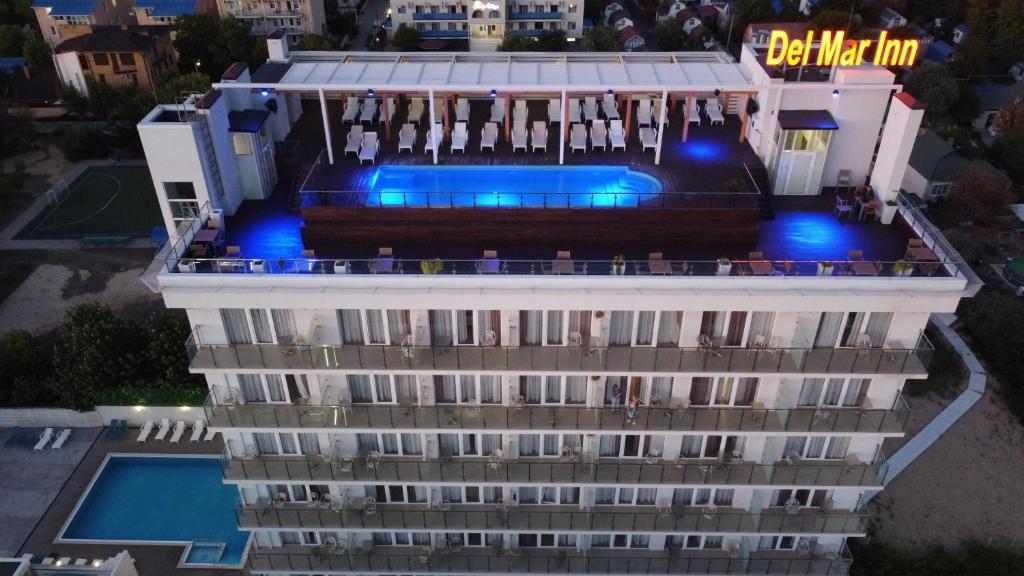 a building with a swimming pool on top of it at Hotel DelMarInn All inclusive in Vityazevo