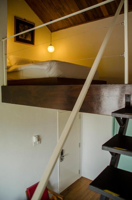 Postel nebo postele na pokoji v ubytování Ren I Tang Heritage Inn