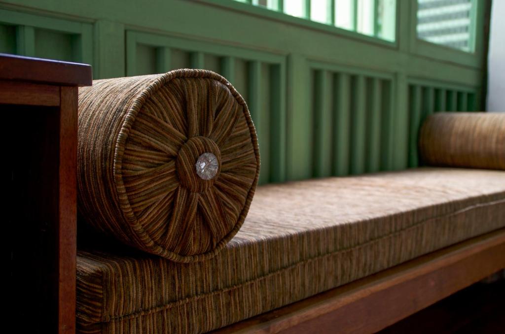 Postel nebo postele na pokoji v ubytování Ren I Tang Heritage Inn