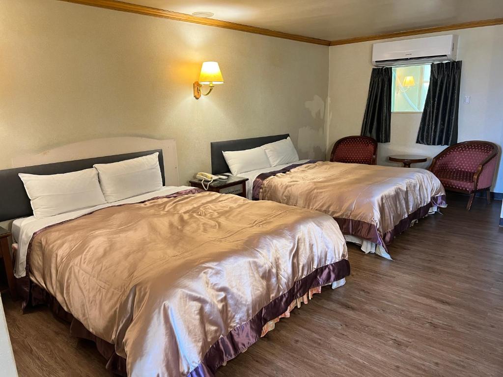 Postel nebo postele na pokoji v ubytování San Ho Business Hotel