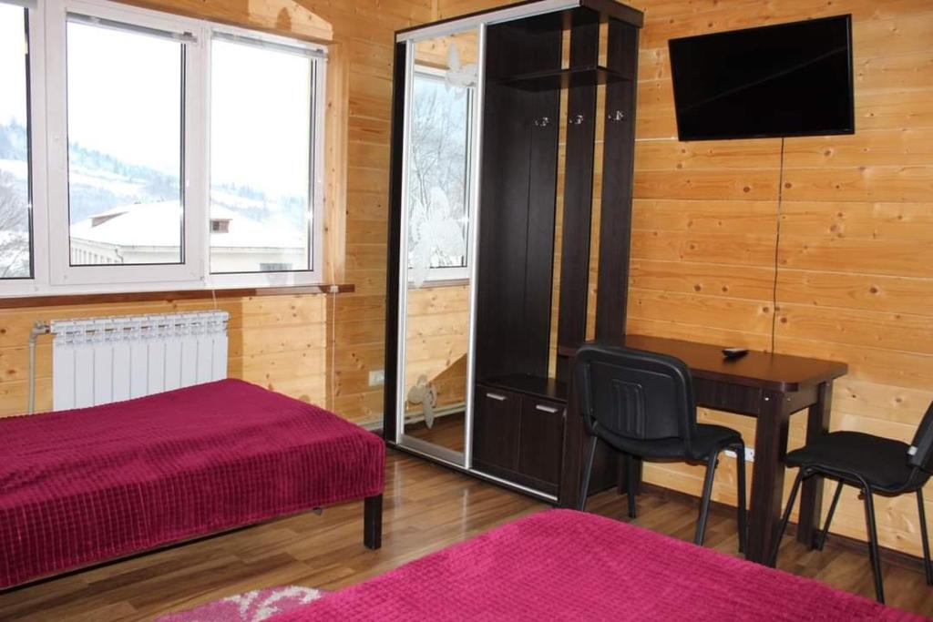 Postel nebo postele na pokoji v ubytování У Інни