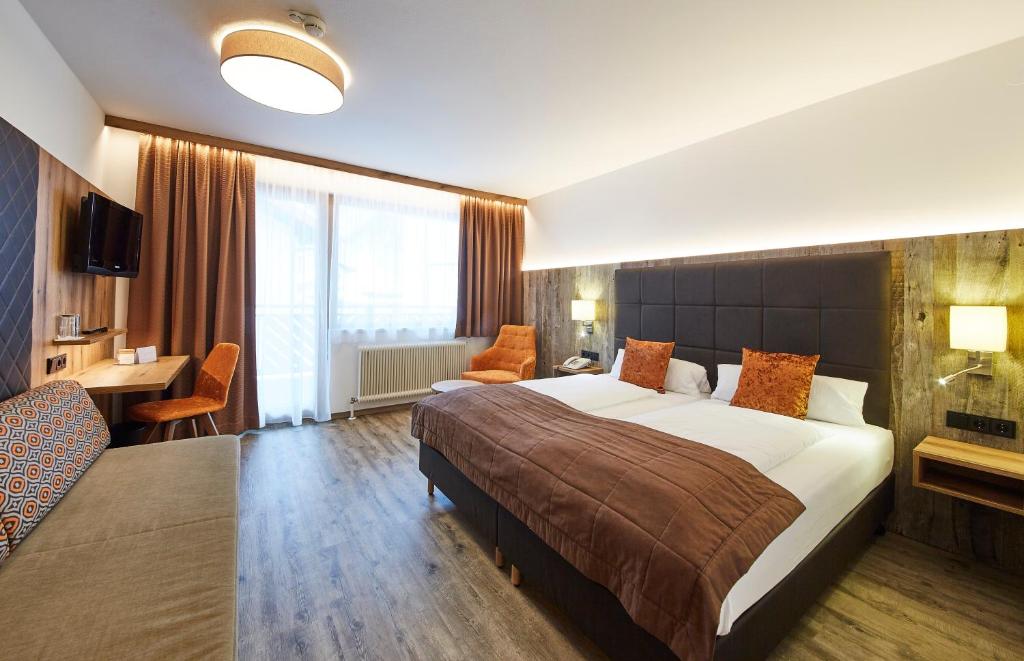 Postel nebo postele na pokoji v ubytování Hotel Römerhof