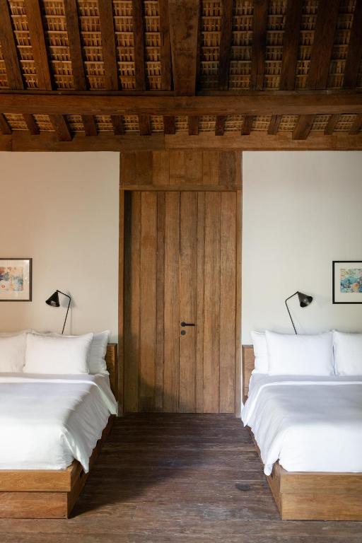 Postel nebo postele na pokoji v ubytování The Asa Maia - Bespoke Wellness Resort