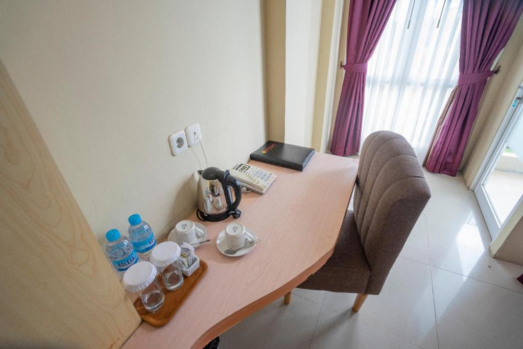 Příslušenství pro přípravu čaje a kávy v ubytování Bangka City Hotel