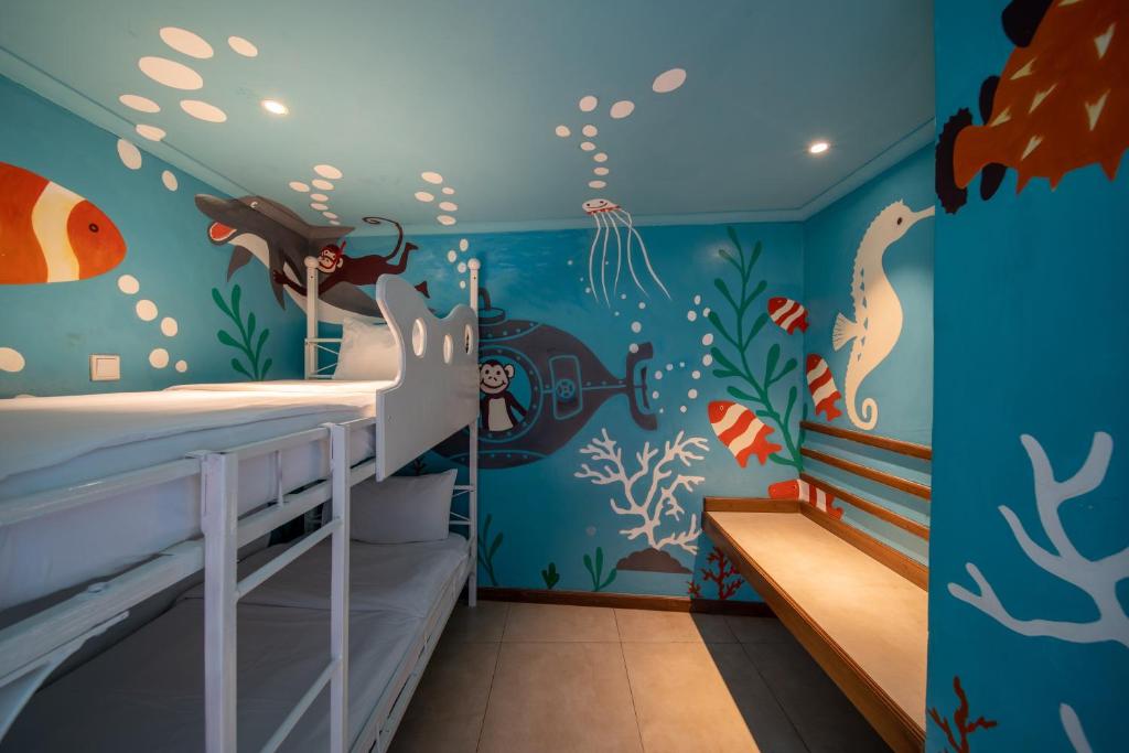 Postel nebo postele na pokoji v ubytování PrideInn Paradise Beach Resort & Spa Mombasa