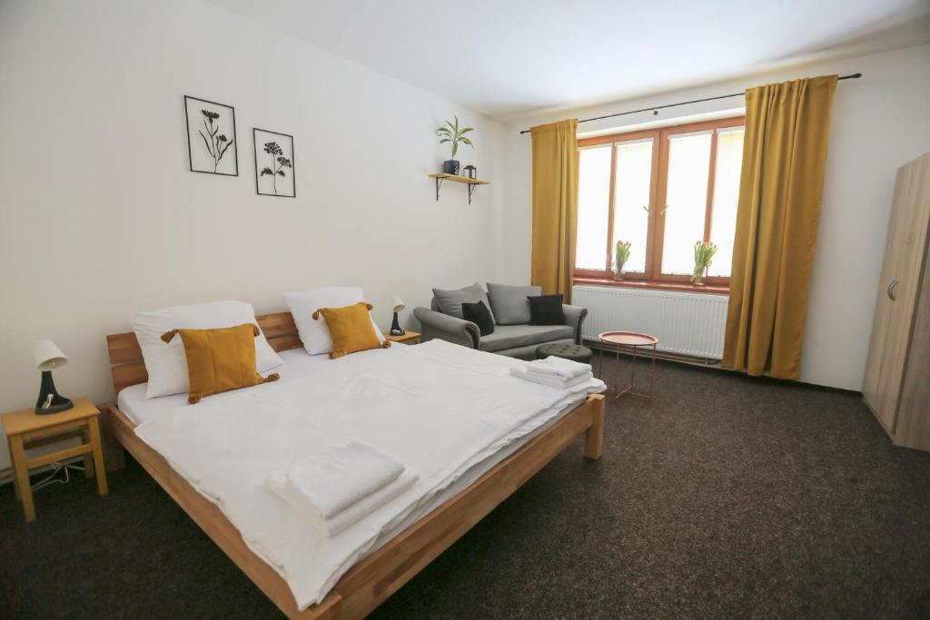 Postel nebo postele na pokoji v ubytování Apartmány Krátká