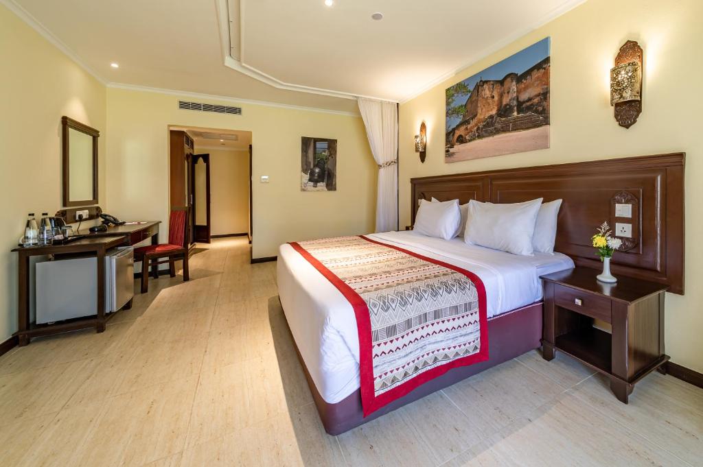 Postel nebo postele na pokoji v ubytování PrideInn Paradise Beach Resort & Spa Mombasa