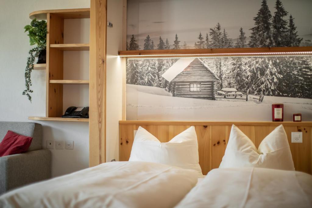 Una cama o camas en una habitación de Appartamenti presso Hotel Europa