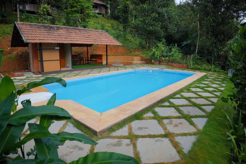 Bazén v ubytování Ananterra Resort Wayanad nebo v jeho okolí