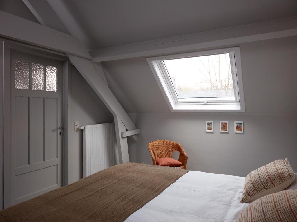 Un ou plusieurs lits dans un hébergement de l'établissement La Petite Histoire gîtes-appartements
