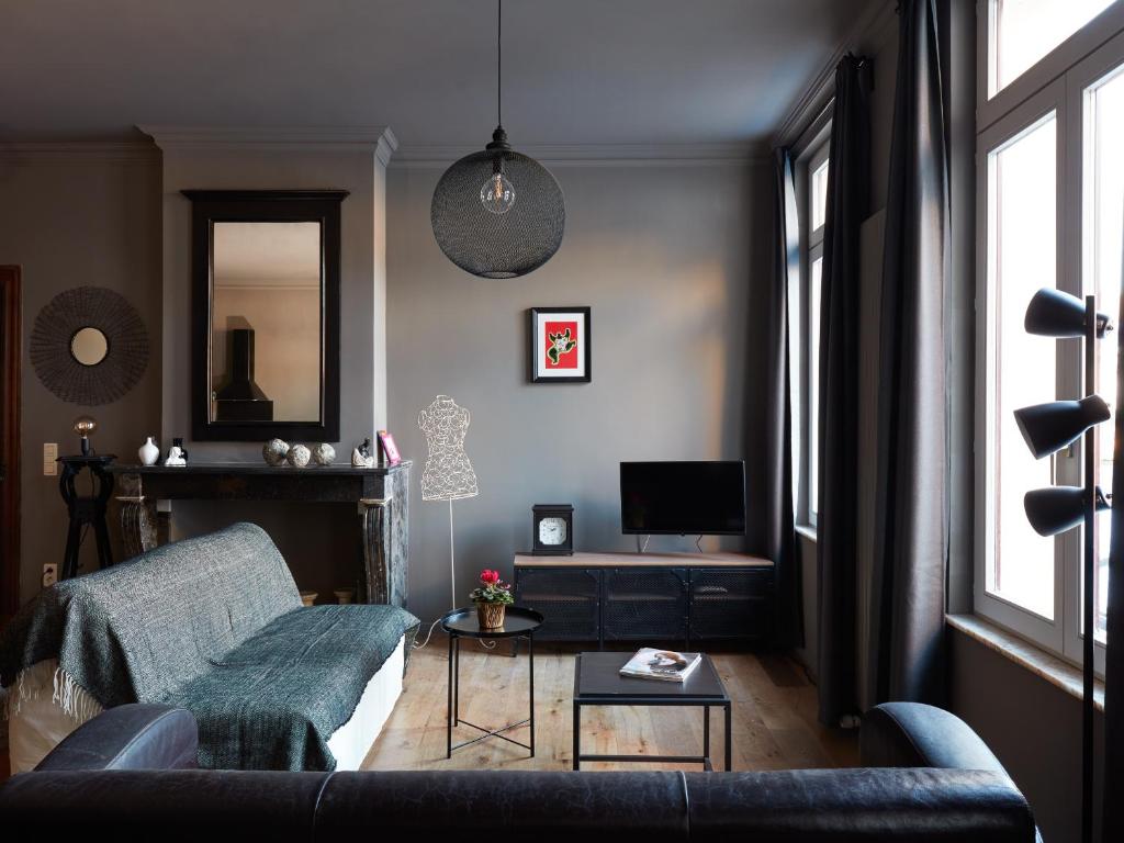 Un ou plusieurs lits dans un hébergement de l'établissement La Petite Histoire gîtes-appartements