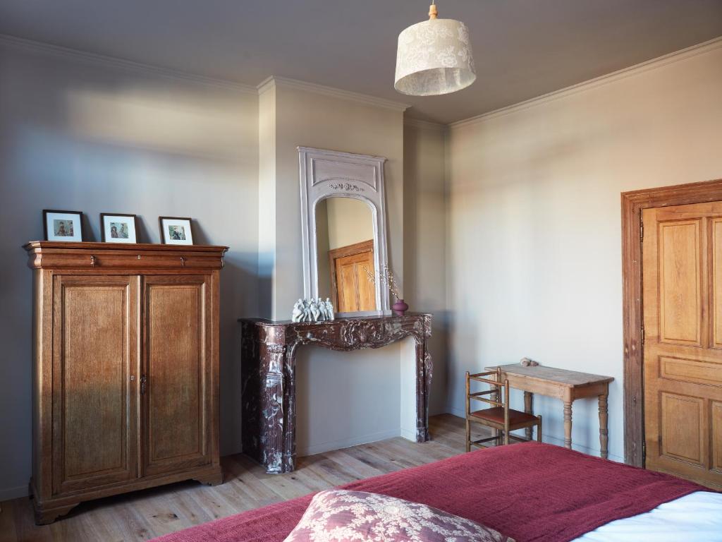 Un ou plusieurs lits dans un hébergement de l'établissement La Petite Histoire gîtes-appartements