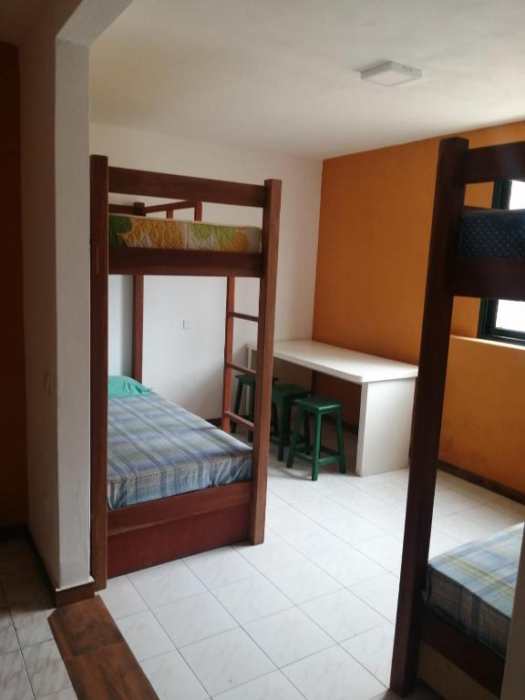 Postel nebo postele na pokoji v ubytování Surf House Hostel