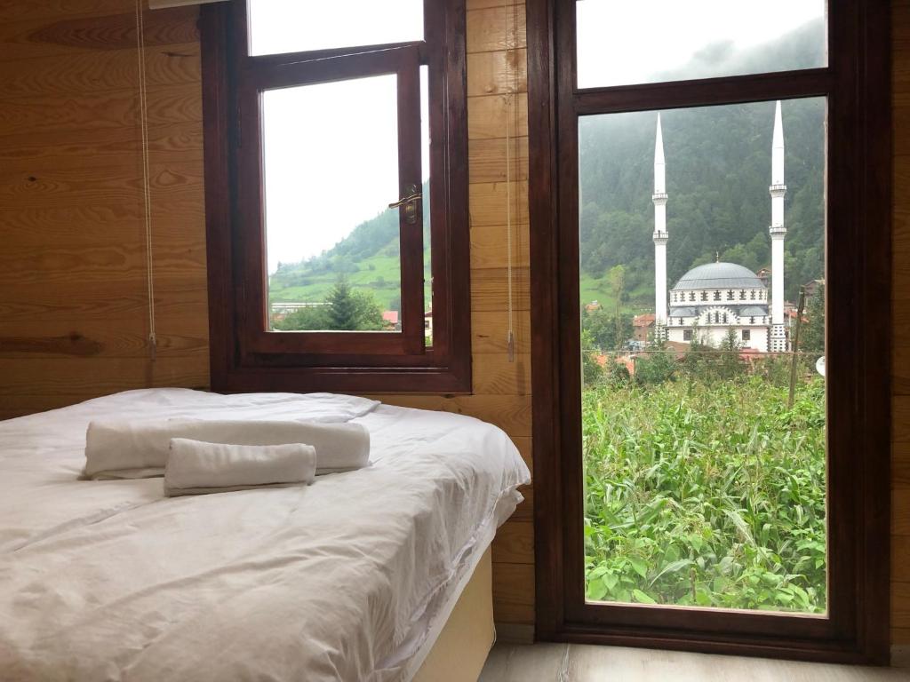 A bed or beds in a room at CERRAHPAŞA SUİTE HOTEL