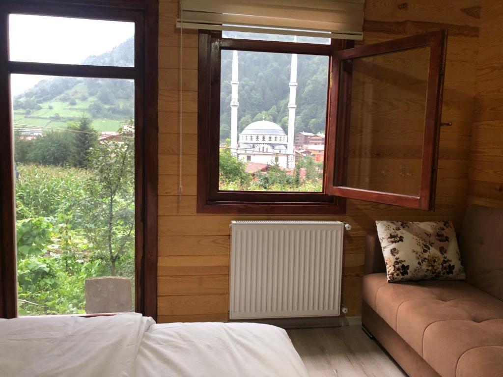 A bed or beds in a room at CERRAHPAŞA SUİTE HOTEL