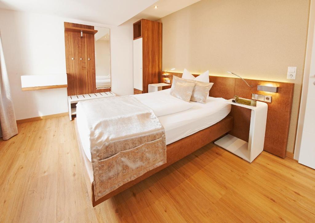 Postel nebo postele na pokoji v ubytování Hotel Nordwind