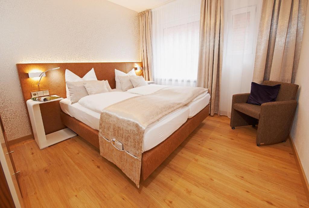 Postel nebo postele na pokoji v ubytování Hotel Nordwind