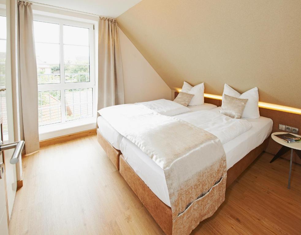 Postel nebo postele na pokoji v ubytování Hotel Nordwind