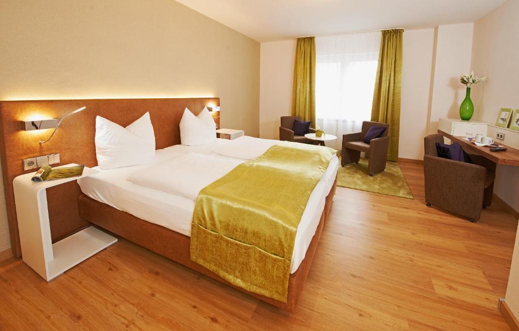 Postel nebo postele na pokoji v ubytování Hotel Nordwind