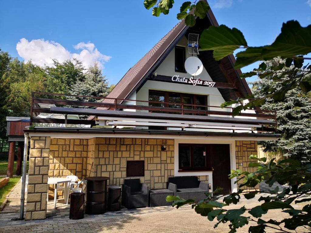 a building with a sign on top of it at Chata Sofia Námestovo in Námestovo