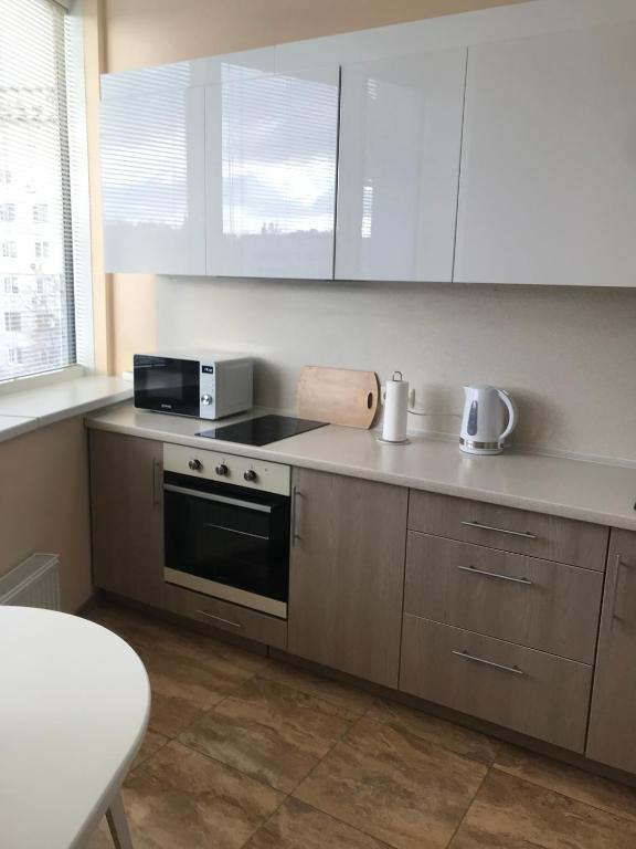 Kuchyň nebo kuchyňský kout v ubytování Apart Assistant on Smart Plaza