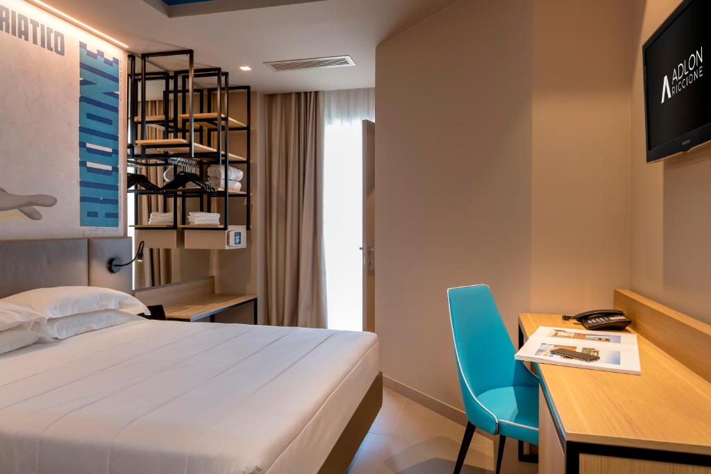 Postel nebo postele na pokoji v ubytování Hotel Adlon - FRONTE MARE